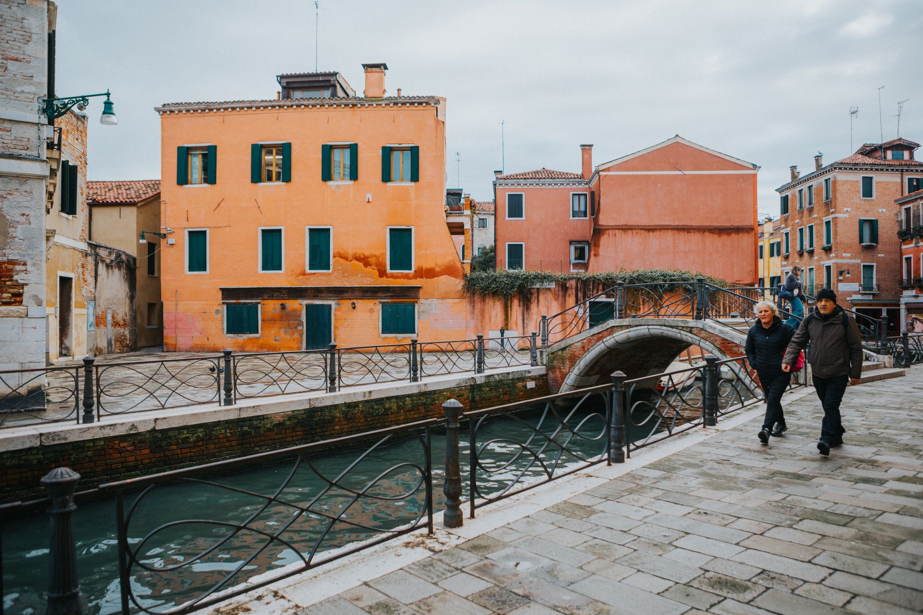 A picturesque scene of Venice with colorful buildings lining a serene canal, showcasing its unique architectur
